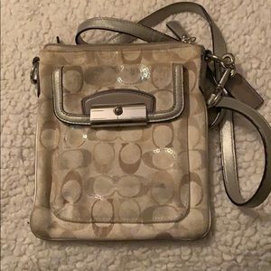 Grey and white coach side body bag
